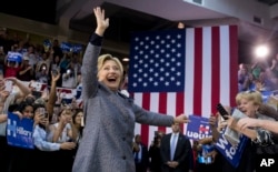 Democratic presidential candidate Hillary Clinton arrives to a cheering crowd to speak at a campaign event at the Grady Cole Center in Charlotte, N.C., Monday, March 14, 2016.