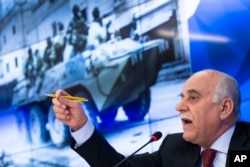 General Mustafa Al-Sheikh, former head of the Free Syrian Army and the head of a Syrian opposition delegation visiting Moscow, gestures while speaking to reporters in Moscow, Jan. 13, 2017. Al-Sheikh commented on the planned Syria peace conference in Astana, saying its main goal is to secure a lasting cease-fire in Syria and prepare talks in Geneva on Syria political settlement.