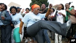 FILE - Treatment Action Campaign supporters chant and dance during a demonstration in Cape Town, South Africa.