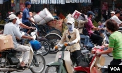 FILE- Motorbikes on the street of Ho Chi Minh City. (Hai Do)