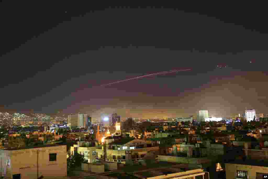 Damascus skies erupt with anti-aircraft fire as the U.S. and its allies target different parts of the Syrian capital Damascus, Syria, April 14, 2018.