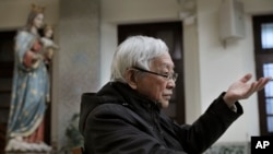 Retired archbishop of Hong Kong Cardinal Joseph Zen gestures during an interview in Hong Kong, Friday, Feb. 9, 2018.