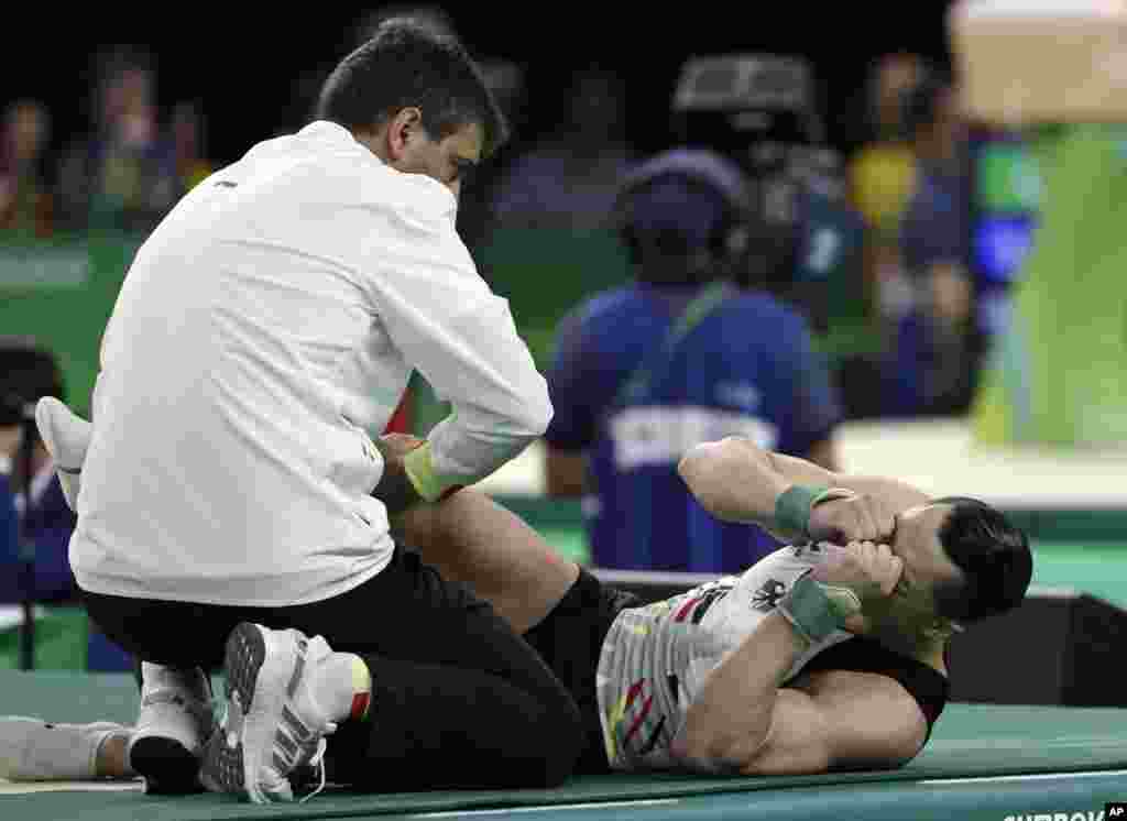 Germany's Andreas Toba reacts after falling while performing his floor routine during the artistic gymnastics men's qualification at the 2016 Summer Olympics in Rio de Janeiro, Brazil, Aug. 6, 2016. 