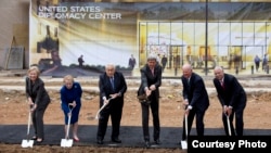  From left, Hillary Rodham Clinton, Madeleine Albright, Henry Kissinger, John Kerry, James A. Baker III, and Colin Powell participate in the groundbreaking ceremony for the U.S. Diplomacy Center, Sept. 3, 2014, at the State Department. (AP Photo/Carolyn Kaster)