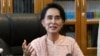 Myanmar opposition leader Aung San Suu Kyi speaks to journalists during a press conference at a parliament building, April 9, 2015 in Naypyidaw.