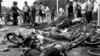 The bodies of dead civilians lie among mangled bicycles near Beijing's Tiananmen Square, June 4, 1989. 