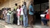 Voters line up to cast their ballots in Lome, Togo, July 25, 2013. 