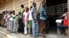 Voters line up to cast their ballots in Lome, Togo, July 25, 2013. 