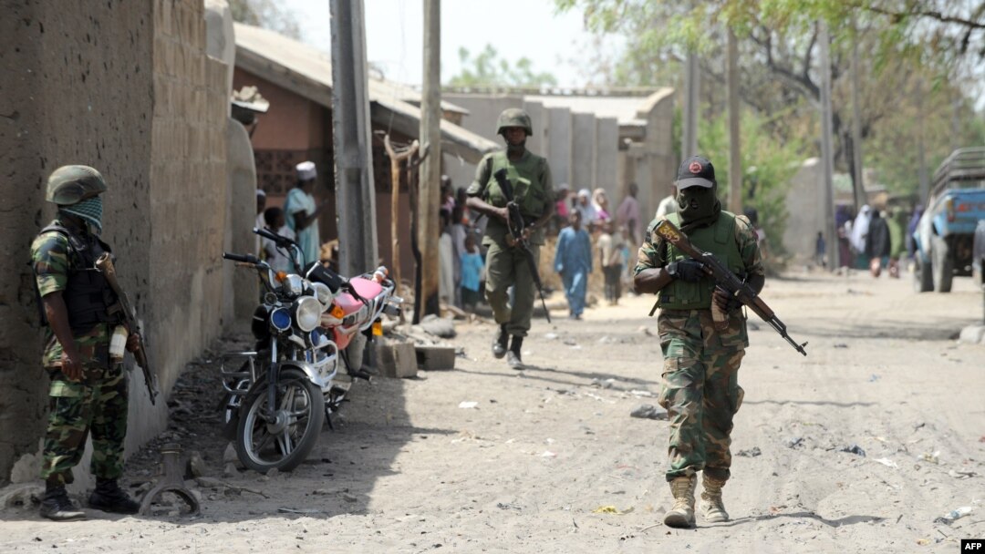 Nigerian soldiers are seen patrolling a town in Borno state, April 30, 2013.