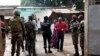 FILE - Security troops stand outside a polling station during the initial presidential elections in Bamako, Mali, July 29, 2018.