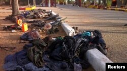 Recovered weapons, personal items and bodies Nigerian Islamist sect Boko Haram in Bama, Maiduguri, Borno State, May 7, 2013.