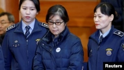 FILE - Choi Soon-sil, the woman at the centre of the South Korean political scandal and long-time friend of President Park Geun-hye, arrives for a hearing arguments for South Korean President Park Geun-hye's impeachment trial at the Constitutional Court i