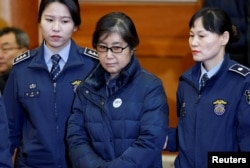FILE - Choi Soon-sil, the woman at the centre of the South Korean political scandal and long-time friend of President Park Geun-hye, arrives for a hearing arguments for South Korean President Park Geun-hye's impeachment trial at the Constitutional Court.