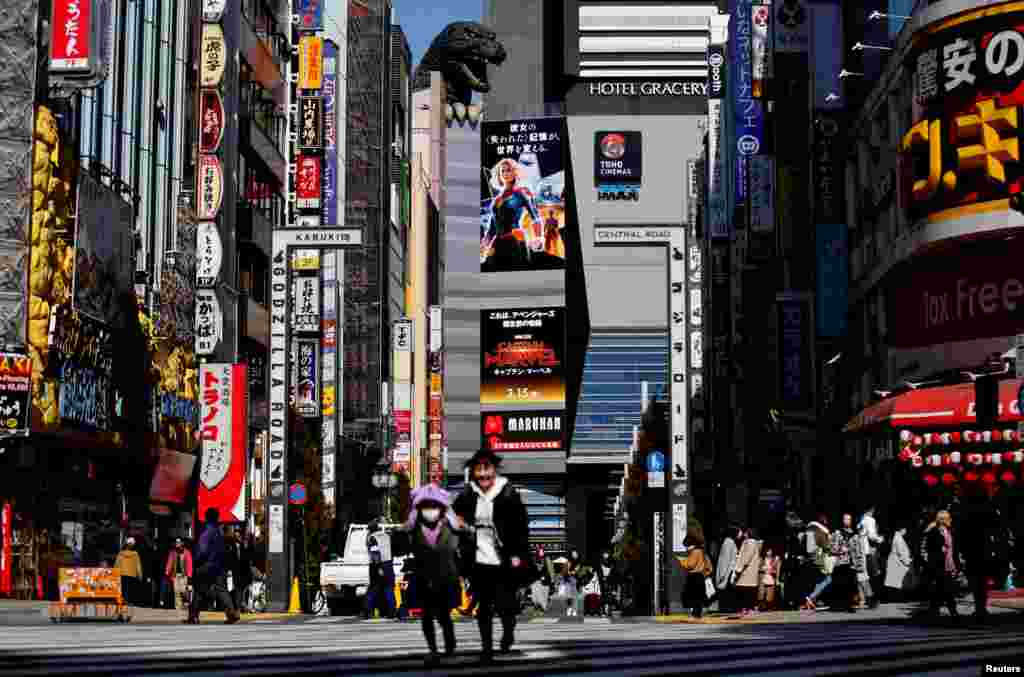 The head of Godzilla, a Japanese monster movie character, is seen on a building of Toho Cinema in Tokyo, Japan.