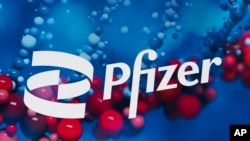 FILE: The Pfizer logo is displayed at the company's headquarters in New York, on Feb. 5, 2021. 