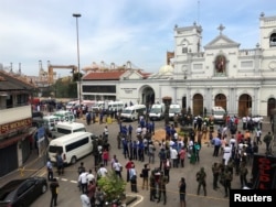 Sri Lankan military officials stand guard in front of the St. Anthony's Shrine, Kochchikade church after an explosion in Colombo, Sri Lanka, April 21, 2019.