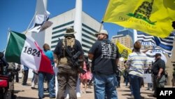 Gun advocates stage a counter-protest in response to protesters opposing the NRA's annual convention on Saturday, May 5, 2018 in Dallas, Texas.