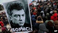 People gather in St. Petersburg, Russia, to commemorate the 2015 slaying of opposition leader Boris Nemtsov, Feb. 27, 2016.