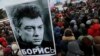 People gather in St. Petersburg, Russia, to commemorate the 2015 slaying of opposition leader Boris Nemtsov, Feb. 27, 2016.