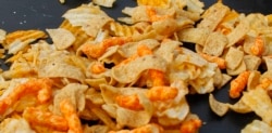 FILE - A mixture of salty snacks and chips is shown on a table in Pittsburgh's Market Square, Feb. 7, 2012.