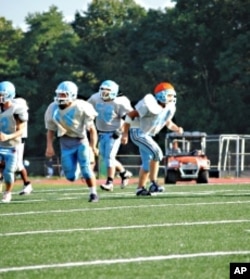 Rakin Hamad (middle, number 58) fasted during the last three football seasons but decided not to this year due to the extreme heat.