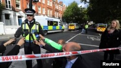 Deputy Chief Constable Adrian Hanstock of the British Transport Police makes a statement to the media after an incident at Parsons Green underground station in London, Britain, Sept. 15, 2017. 