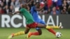 FILE - France's Blaise Matuidi, right, is tackled by Cameroon's Allan Nyom during a friendly soccer match between France and Cameroon at the La Beaujoire Stadium in Nantes, France, May 30, 2016.