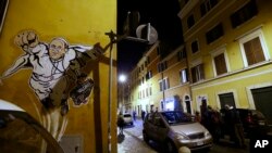 A graffiti depicting Pope Francis as Superman and holding a bag with a writing which reads: 'Values' is seen on a wall of the Borgo Pio district near St. Peter's Square in Rome, Tuesday, Jan. 28, 2014. 