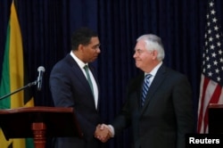 Jamaica's Prime Minister Andrew Holness and U.S. Secretary of State Rex Tillerson shake hands in Kingston, Jamaica, Feb. 7, 2018.