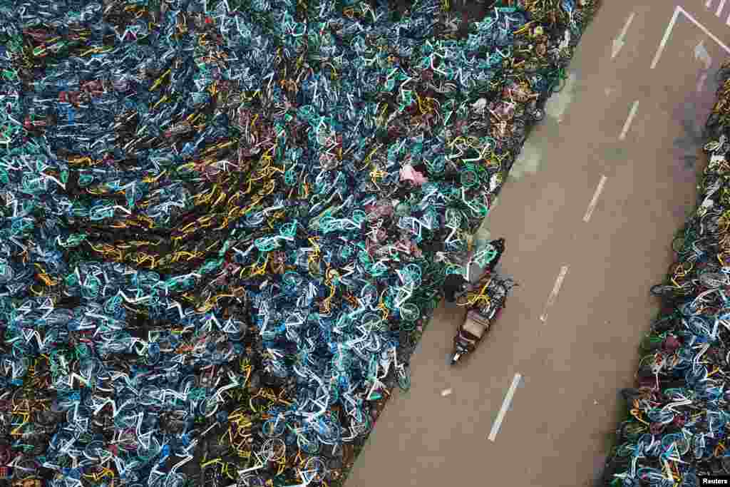 Bicycles from various bike-sharing services are piled up in Hefei, Anhui province, China.