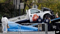 The Home Depot truck used in the bike path attack is removed from the crime scene, Nov. 1, 2017, in New York. 