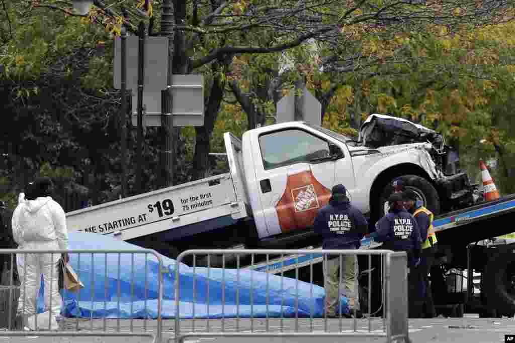 The Home Depot truck used in the bike path attack is removed from the crime scene, Nov. 1, 2017, in New York.