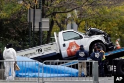 The Home Depot truck used in the bike path attack is removed from the crime scene, Nov. 1, 2017, in New York.