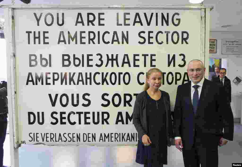 Freed Russian former oil tycoon Mikhail Khodorkovsky and Alexandra Hildebrandt, director of Museum Haus am Checkpoint Charlie, pose for a picture in the museum in Berlin, Germany, Dec. 22, 2013. 