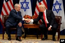 President Donald Trump shakes hands with Israeli Prime Minister Benjamin Netanyahu during a meeting at the Palace Hotel during the United Nations General Assembly in New York, Sept. 18, 2017.