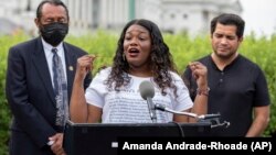 Rep. Cori Bush, D-Mo. (C) with Rep. Al Green, D-Texas (L) and Rep. Jimmy Gomez, D-Calif., (R) speak to the press after it was announced that the Biden administration will enact a targeted nationwide eviction moratorium Aug. 3, 2021. (AP Photo/Amanda Andrade-Rhoades)