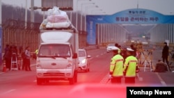 A truck passes the bridge between North and South Korea after leaving the Kaesong Industrial Complex. Tensions have increased as the North has expelled South Koreans and seized assets in response to the South's suspension of the project.