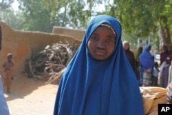 Aishat Alhaji , one of the kidnapped girls from the Government Girls Science and Technical College Dapchi who was freed, is photographed after her release, in Dapchi, Nigeria, March. 21, 2018.