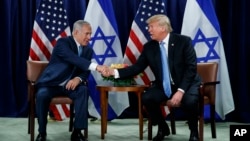 FILE - President Donald Trump shakes hands with Israeli Prime Minister Benjamin Netanyahu at the United Nations General Assembly, Sept. 26, 2018, at U.N. Headquarters.