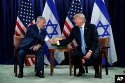 FILE - President Donald Trump shakes hands with Israeli Prime Minister Benjamin Netanyahu at the United Nations General Assembly, at U.N. headquarters, Sept. 26, 2018.