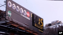 A billboard advertising the record $1.5 billion U.S. Powerball jackpot is seen in downtown Pittsburgh, Pennsylvania, Jan. 12, 2016.