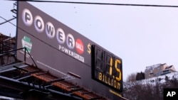 A billboard advertising the record $1.5 billion U.S. Powerball jackpot is seen in downtown Pittsburgh, Pennsylvania, Jan. 12, 2016.