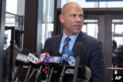 Attorney Michael Avenatti, who is representing an alleged R. Kelly victim, speaks to reporters at the Leighton Criminal Courthouse in Chicago after the R&B singer entered a not guilty plea to all 10 counts of aggravated criminal sexual abuse, Feb. 25, 201