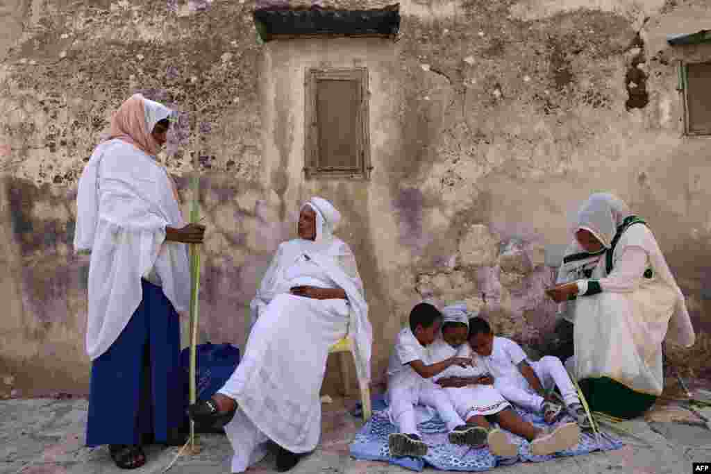 Ethiopian Orthodox Christian worshipers gather during Palm Sunday celebrations outside the Church of the Holy Sepulchre in Jerusalem, April 25, 2021.