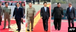 FILE - This combo shows a file photo, left, taken June 13, 2000, of North Korea's leader Kim Jong Il, left, welcoming South Korea's President Kim Dae-jung, right, at SoonAn airport in Pyongyang; a file photo, center, taken Oct. 2, 2007, of South Korea's President Roh Moo-Hyun, right, and North Korea's leader Kim Jong Il, left, viewing an honor guard during a welcoming ceremony in Pyongyang; and an image, right, taken April 27, 2018, of North Korea's leader Kim Jong Un, left, walking with South Korea's President Moon Jae-in, right, on the red carpet to the official summit Peace House building for their meeting on the South's side of the truce village of Panmunjom.