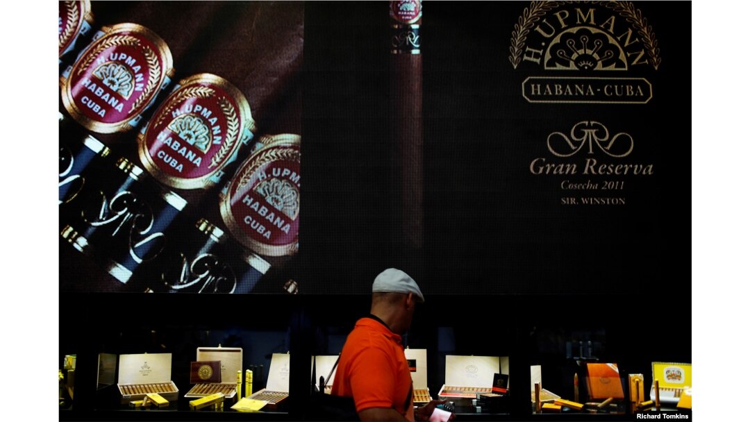 A visitor looks at cigars on display at the 19th Habanos Festival in Havana, Cuba, Feb. 27, 2017.