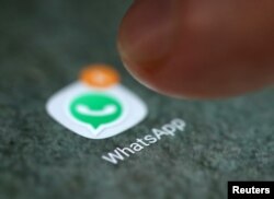 FILE - The WhatsApp icon is seen on a smartphone in this picture illustration, in Sarajevo, Bosnia and Herzegovina.