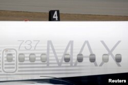 FILE - A Boeing 737 MAX 8 aircraft is parked at a Boeing production facility in Renton, Washington, March 11, 2019.