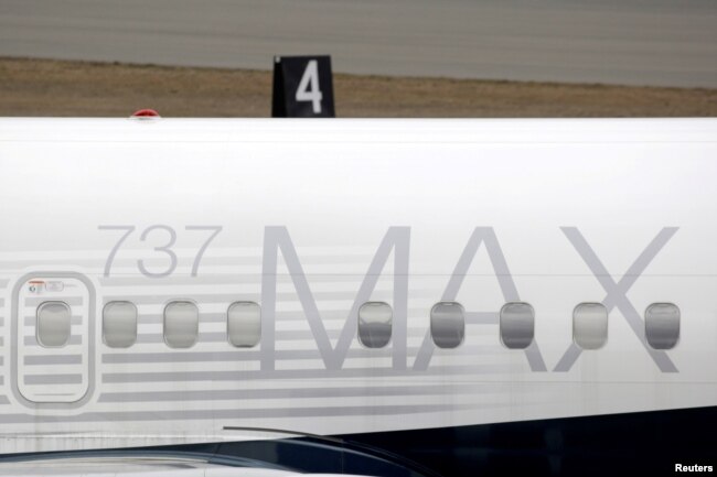 FILE - A Boeing 737 MAX 8 aircraft is parked at a Boeing production facility in Renton, Washington, March 11, 2019.