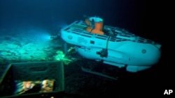 The Pisces IV submersible sits atop the summit of Cook seamount, as seen from the Pisces V craft, during a dive to the previously unexplored underwater volcano off the coast of Hawaii's Big Island on Sept. 6, 2016.